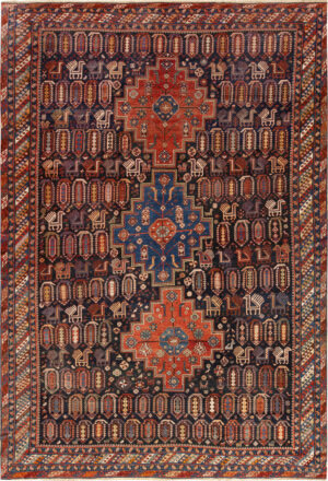 A modern Baku carpet with a dark blue field full of small paisley shapes and birds, three stepped medallions in red and blue, and a border of diagonal stripes.